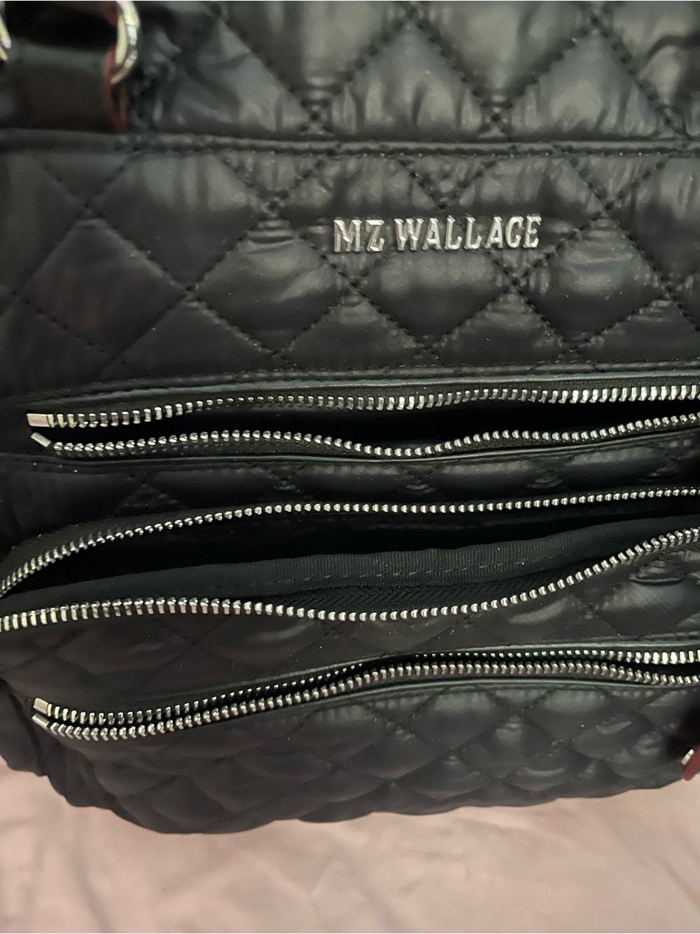 MZ Wallace Black Quilted Multi-Pocket Backpack. Slightly used